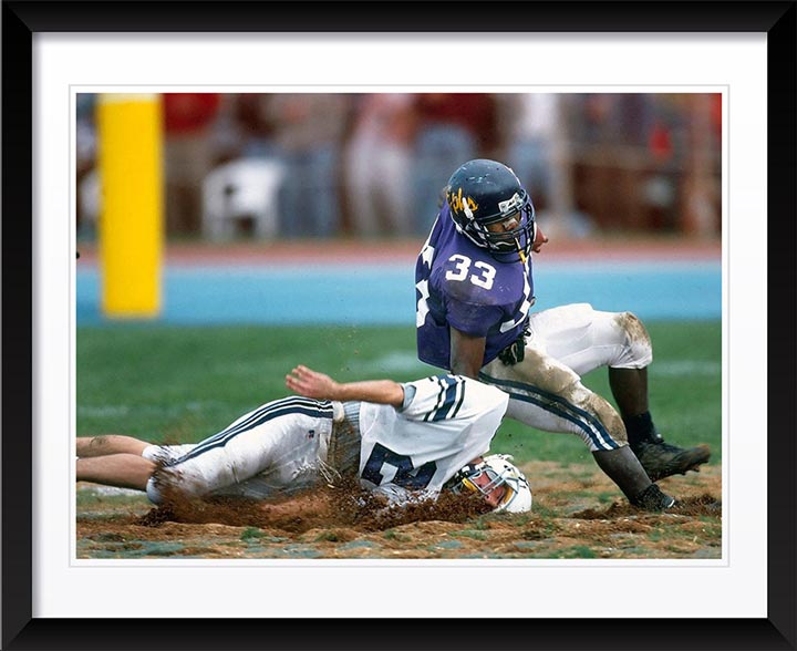 "Football in the Mud" by Chuck Solomon Photography