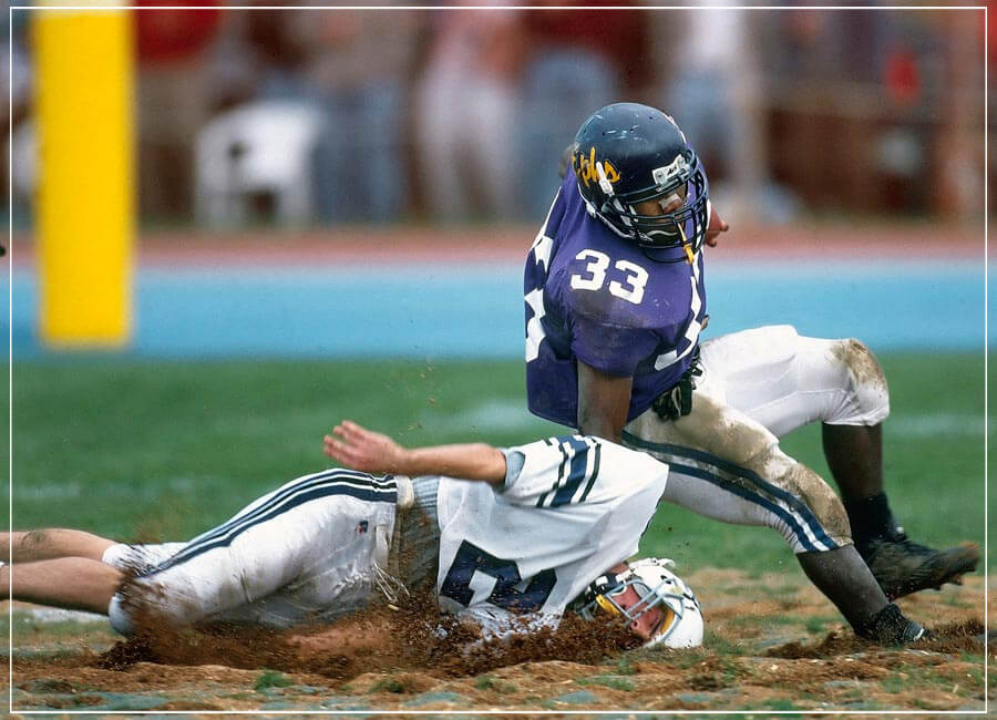 "Football in the Mud" by Chuck Solomon Photography-Artography Limited